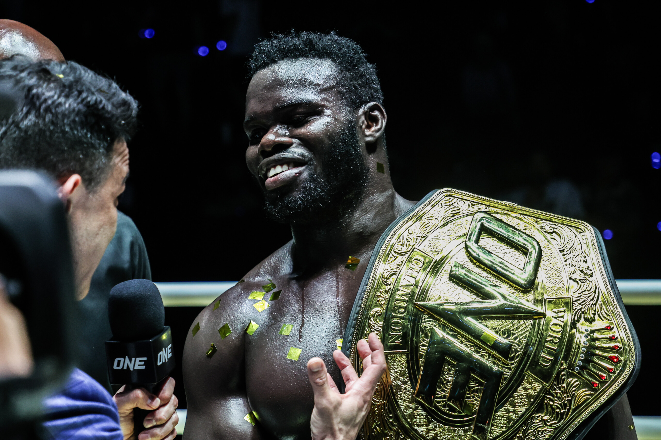 "Reug Reug" Oumar Kane smiles with the belt